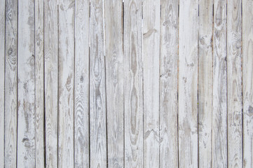Fototapeta na wymiar white old wooden fence. wood palisade background. planks texture, weathered surface