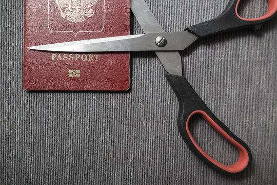 Scissors destroy the passport of a citizen who is under sanctions