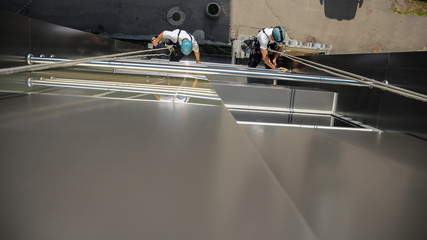 Washers Wash the Windows of Modern Skyscraper