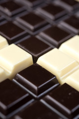 Dark and white chocolate bars combined in a pattern