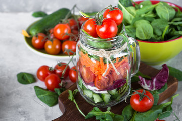 Fresh vegetarian salad in mason jar.