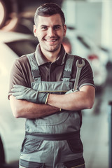Handsome auto service worker