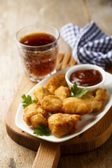 Chicken nuggets with tomato sauce