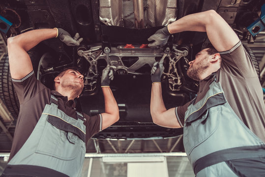 Handsome auto service workers