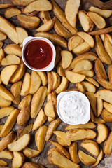 baked finger potatoes with ketchup and yogurt sauce