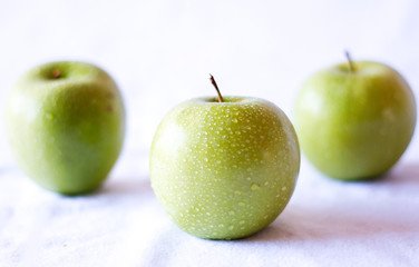 Green apple close up on a white background 