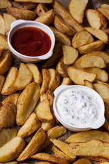 baked finger potatoes with ketchup and yogurt sauce