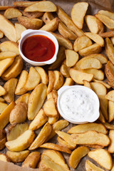 baked finger potatoes with ketchup and yogurt sauce