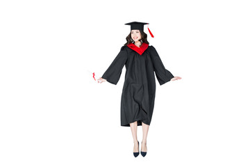 attractive student in graduation cap with diploma jumping isolated on white