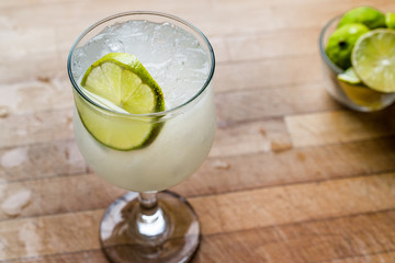 Daiquiri cocktail with lime and crushed ice.