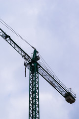 high crane with cloudy sky background