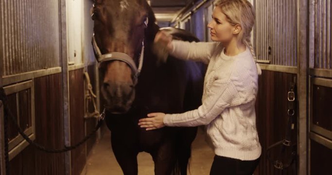 Woman getting horse ready