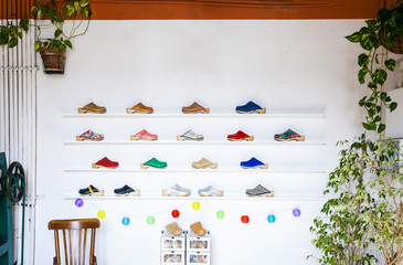 Assortment of clogs on shelf