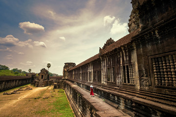 Fototapeta na wymiar Asian girl walking in Angkor Wat temple, Siem Reap, Cambodia