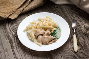 Pasta penne with chicken and homemade parsley sauce