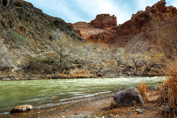 Mountain river against the background of red rocks