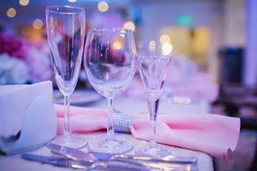 Glasses of different sizes on a serving table