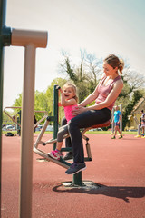 Mother and daughter outdoor exercise.