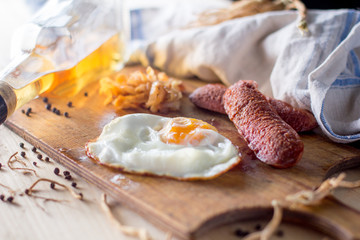 fried eggs with sausages and fried cabbage