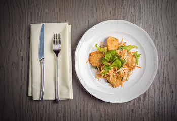 Oriental salad with carrots, greens and sesame seeds