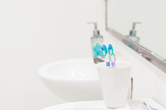 Toothbrush in toilet and selective focus.