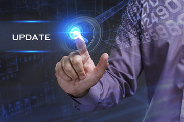 Fototapeta premium Business, Technology, Internet and network concept. Young businessman working on a virtual screen of the future and sees the inscription: Update