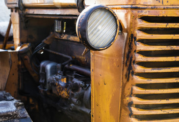Fototapeta na wymiar Old Red rusty Tractor closeup.