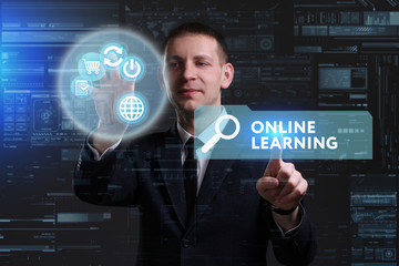 Business, Technology, Internet and network concept. Young businessman working on a virtual screen of the future and sees the inscription: Online learning