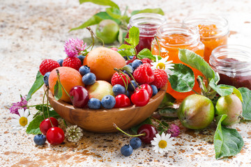 Fototapeta na wymiar seasonal fruits and berries, jams
