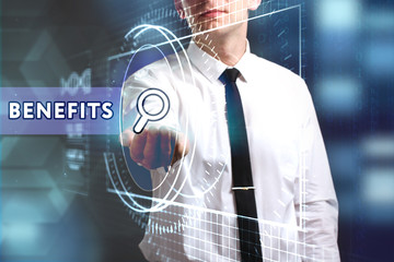 Business, Technology, Internet and network concept. Young businessman working on a virtual screen of the future and sees the inscription: Benefits