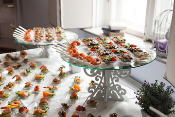 waitress serves tables for cocktail party. catering