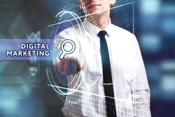 Business, Technology, Internet and network concept. Young businessman working on a virtual screen of the future and sees the inscription: Digital Marketing