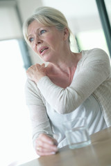 Fototapeta premium Senior woman suffering arthrosis