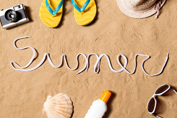 Summer vacation composition. Flip flops, hat and other stuff