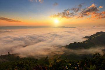 sun over mountain mist in sunrise,mist on sunrise,mist over mountain during sunrise