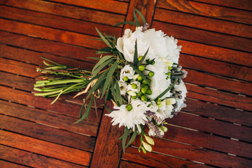 Wedding bouquet on a wooden background. Wedding in Montenegro