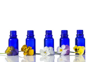 nice pansies,essential oil in glass bottle