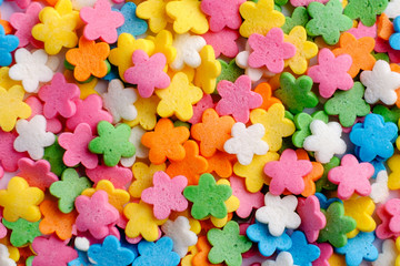 Sugar sprinkle flowers, decoration for cake and bekery, a lot of sprinkles as food background