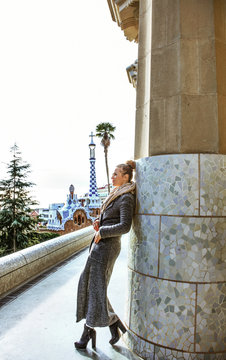 trendy tourist woman in Barcelona, Spain in winter sightseeing