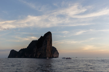 Sunset photo at sea, rock