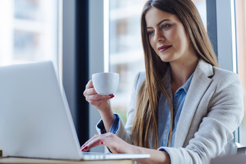 Beautiful Young Woman Working on Laptop