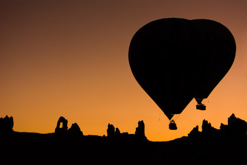 Two balloons lift off predawn in Cappadocia, Turkey