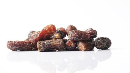 Date fruits on white background. Selective focus.
