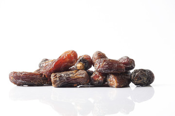 Date fruits on white background. Selective focus.