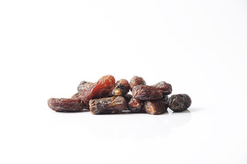 Date fruits on white background. Selective focus.