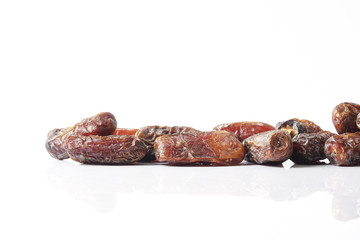 Date fruits on white background. Selective focus.