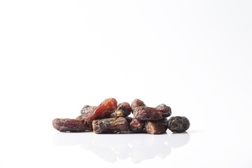 Date fruits on white background. Selective focus.