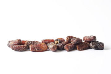 Date fruits on white background. Selective focus.