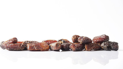 Date fruits on white background. Selective focus.