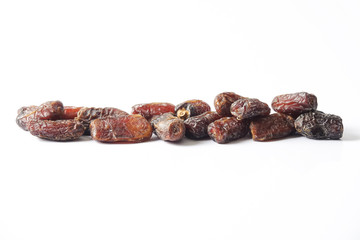Date fruits on white background. Selective focus.